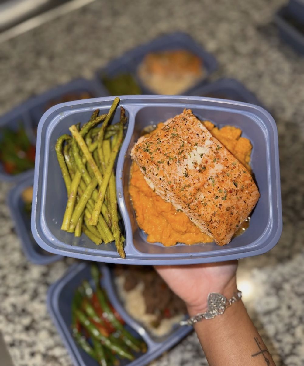 Seasoned salmon over mashed sweet potato with roasted asparagus